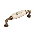 Decorani- stary mosiądz uchwyt ceramiczny z kwiatkiem 96mm.jpg